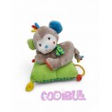 NICOTOY Doudou musical singe couché sur coussin vert